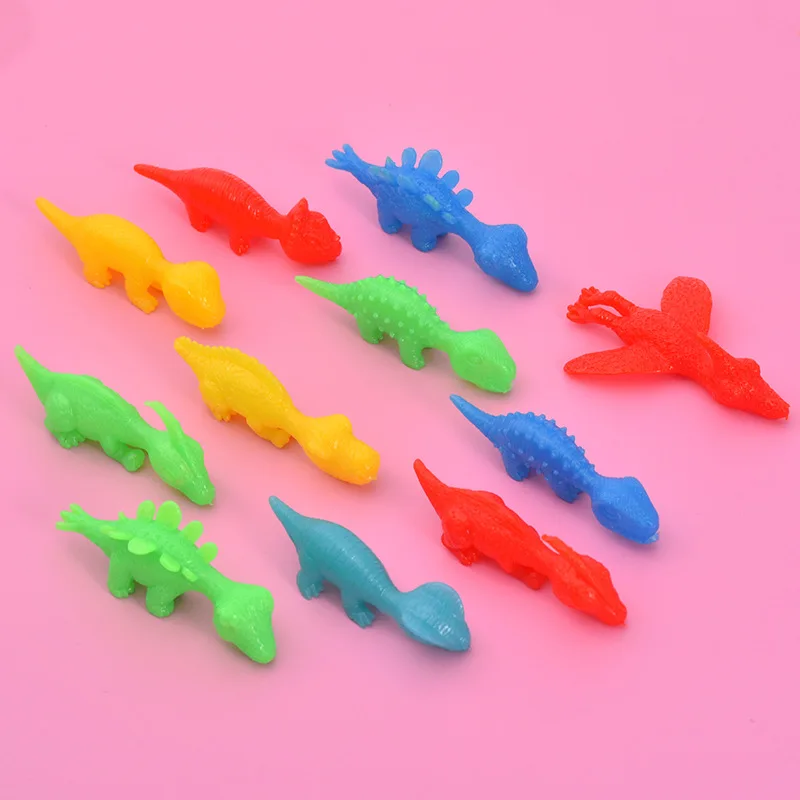 2024 Hot selling New Mini Funny Playful Catapult Flying Squeeze Dino sling shot dino TPR Slingshot Dinosaur Toy