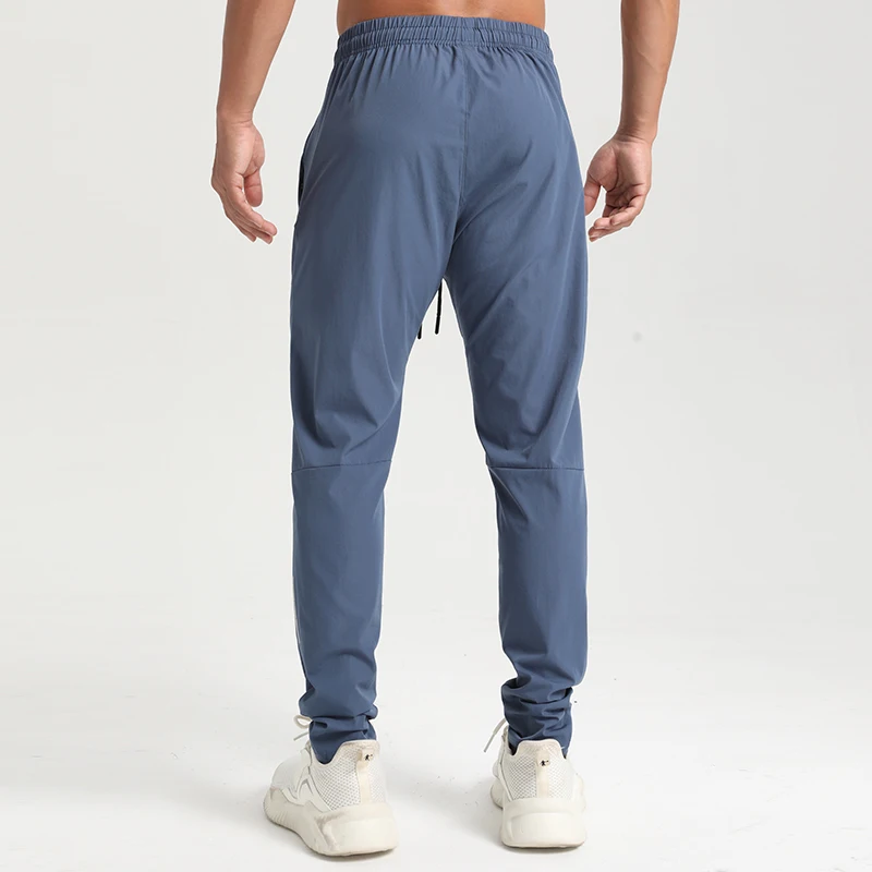 Factory direct sales four solid color blank trousers with drawstring texture quick dry fabric zipper pocket sweatpants men