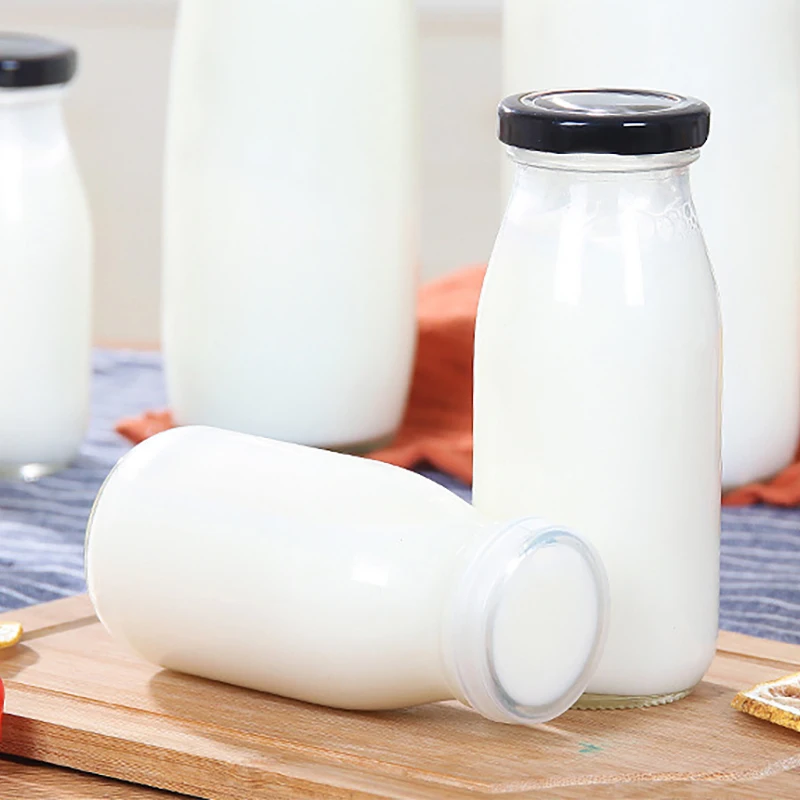 
200ml 250ml 8oz Small Empty Clear Beverage Juice Cold Glass Milk Bottle with Lids in Bulk for Sale 