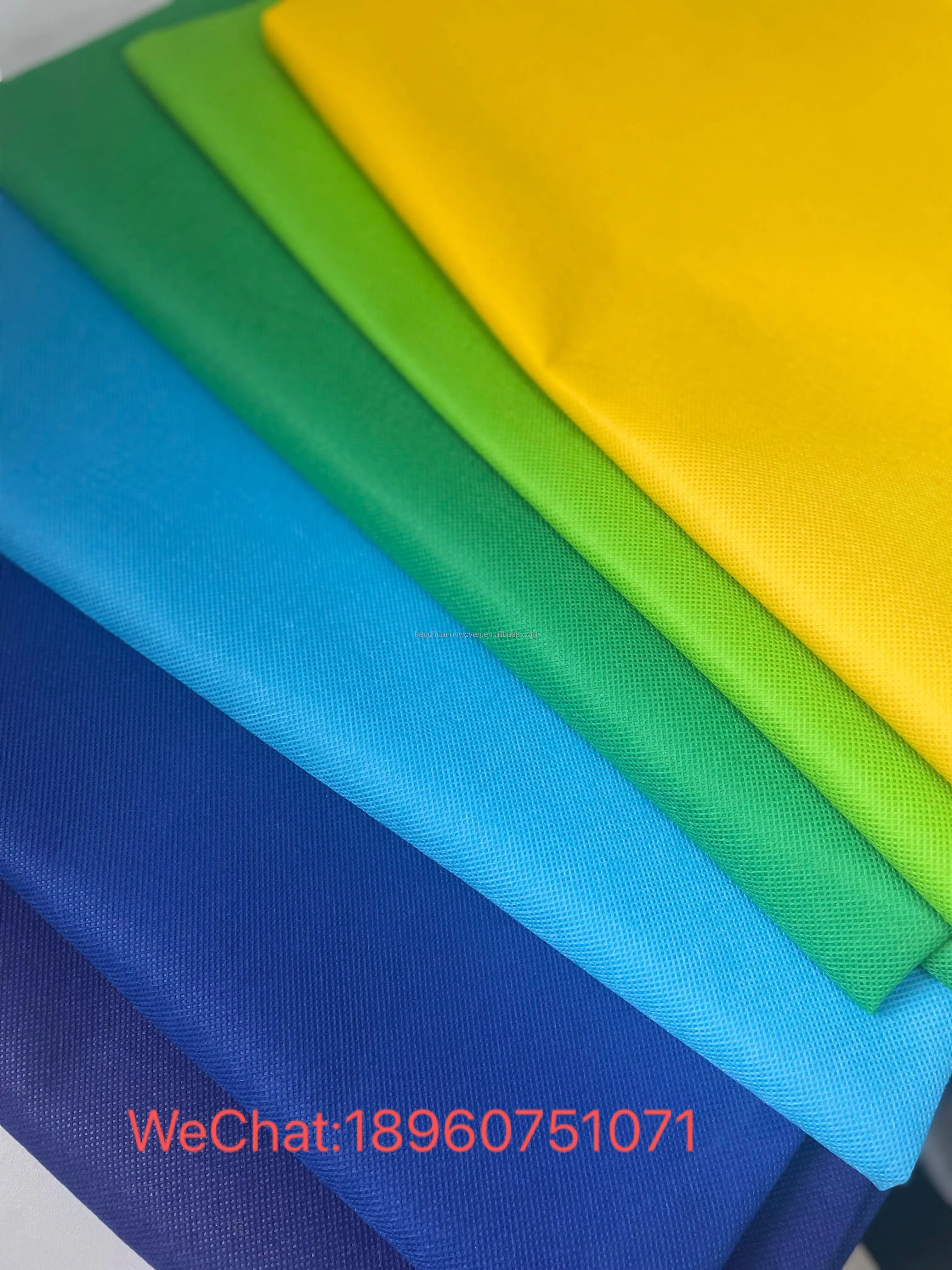 fabric spunbonded polypropylene and biodegradable spunbond nonwoven fabric roll colorful nonwoven fabric manufacturer