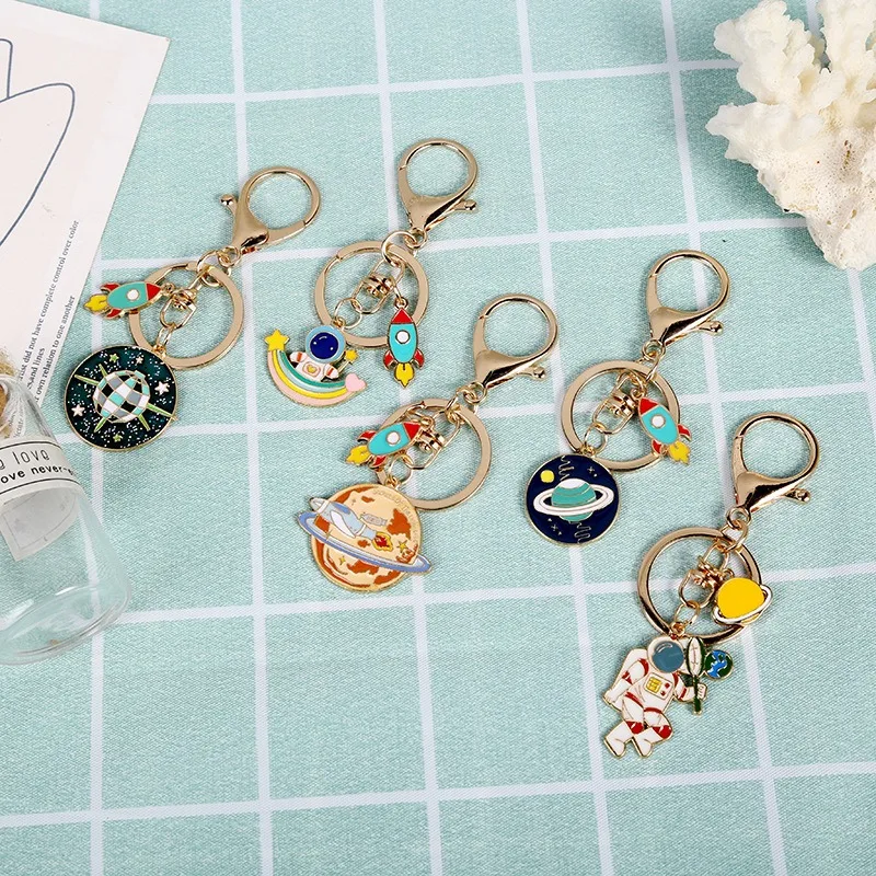 Wholesale Cute Cartoon Students Metal Keychain Bag Car Key Pendant Alloy Universe Starry Sky Rocket Astronaut Keychain