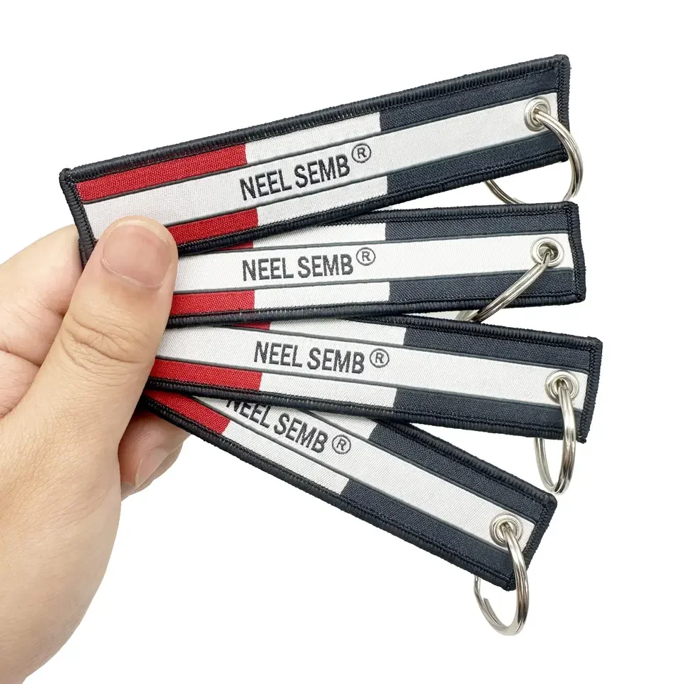 High Quality Custom Double Sided Personalized Text or Logo and Embroidery Fabric Keychain Woven Keyring Tags Flying Jet Tags