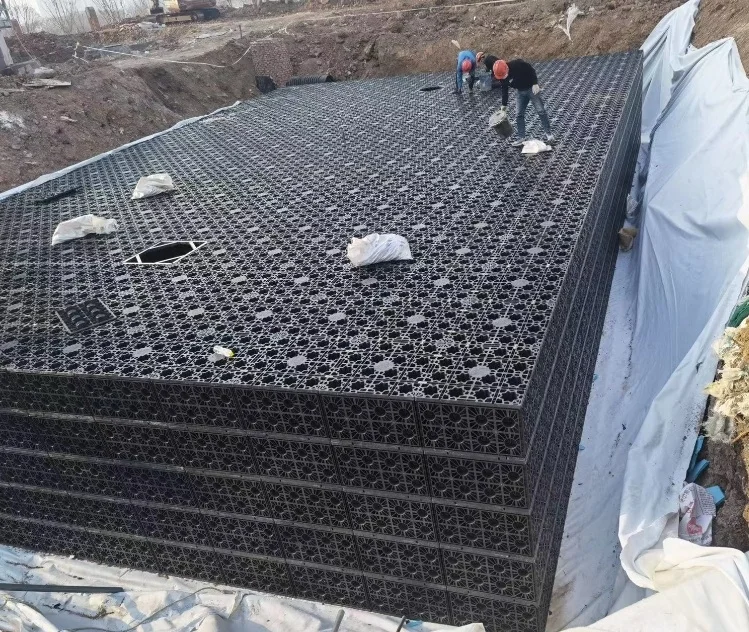 Landscaping garden rainfall collection geocellular modular detention attenuation tank under vehicle driveway and car parking lot