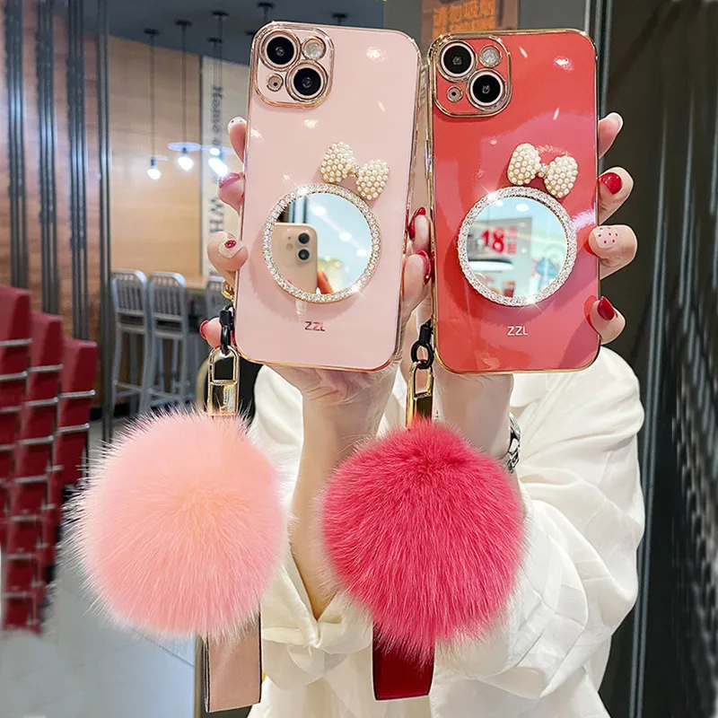 Fashion Luxury Bow Rhinestones Mirror Back Cover Plating TPU Fur Ball hand strap Girls Phone Case for iPhone 13 12 Pro Max