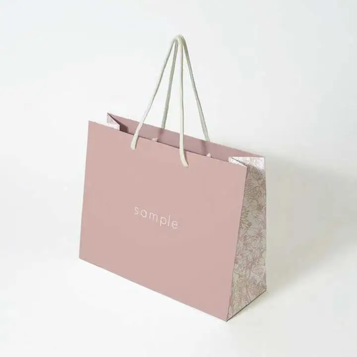 Luxury clothing retail gift paper bag shopping packaging paper bag with handle