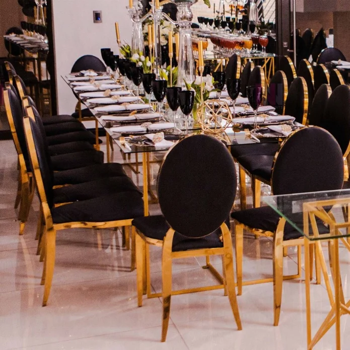Оптовая продажа, штабелируемые прочные стулья из нержавеющей стали золотистого и черного цвета с круглой спинкой для банкетов, торжеств, свадеб