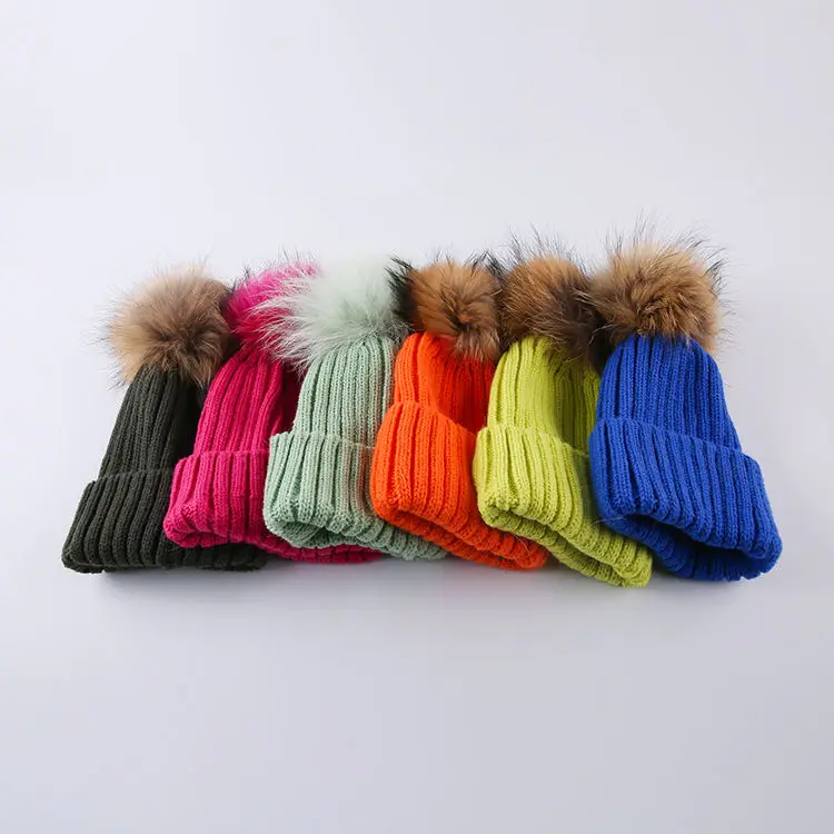30% wool 70% acrylic  Knitted solid color winter hat faux fur ball custom woven embroidery logo beanie hat manufacturers
