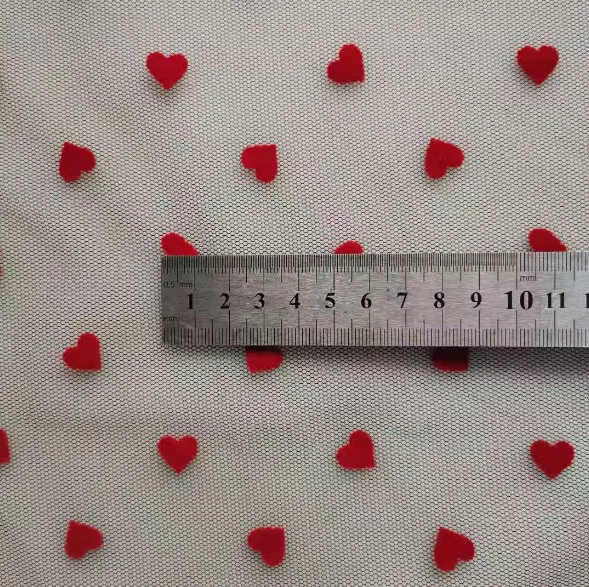 China manufacturer high quality fancy design soft tulle heart flocked mesh fabric for dress