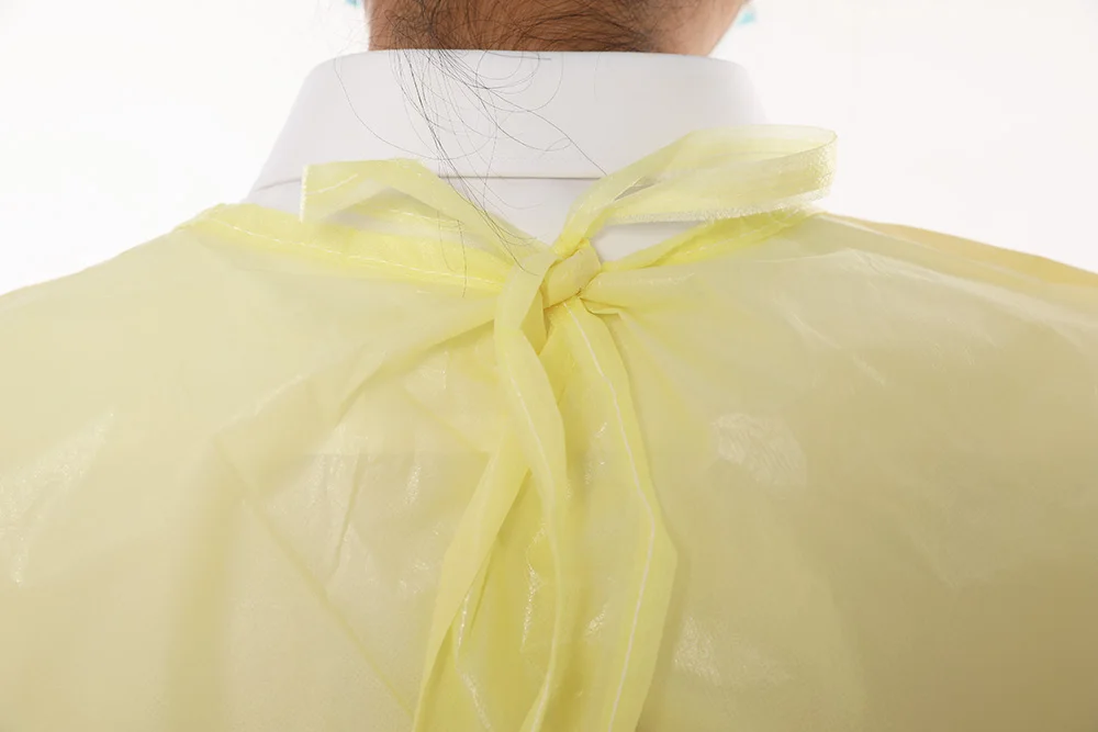 Wholesale ASTM Level 4 PP PE Coated Fully Taped Waterproof  Yellow Disposable Medical Surgical isolation Gown