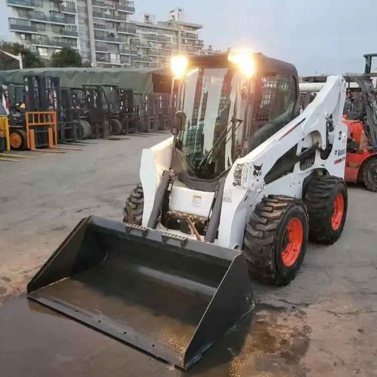 Подержанный высокомощный скользящий погрузчик Bobcat S750 с грузоподъемностью 1 4 тонн продается дешево а S70