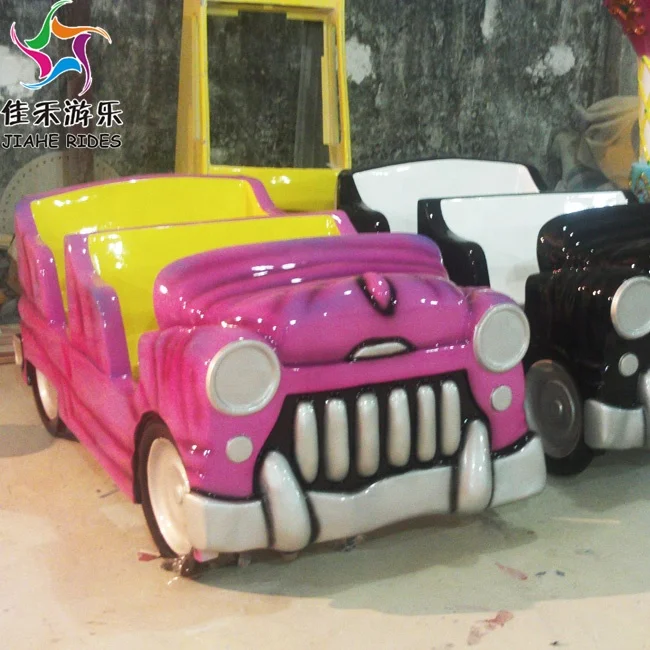 Fairground attraction amusement park rotating coffee cup tea cup rides Magic car rides