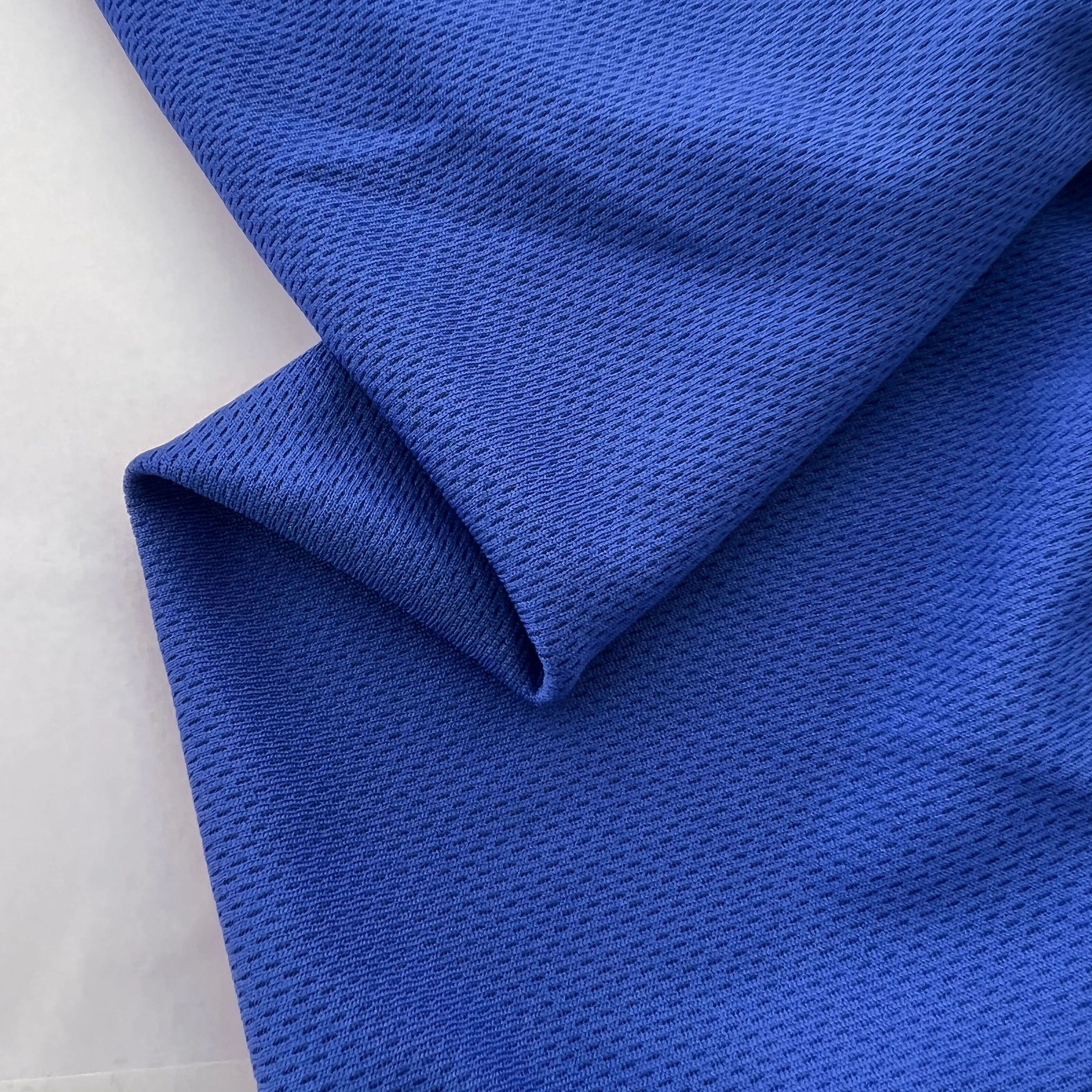 Wholesale High Quality Navy Blue 100% Polyester Mesh Bird Eye Fabric Fluorescent