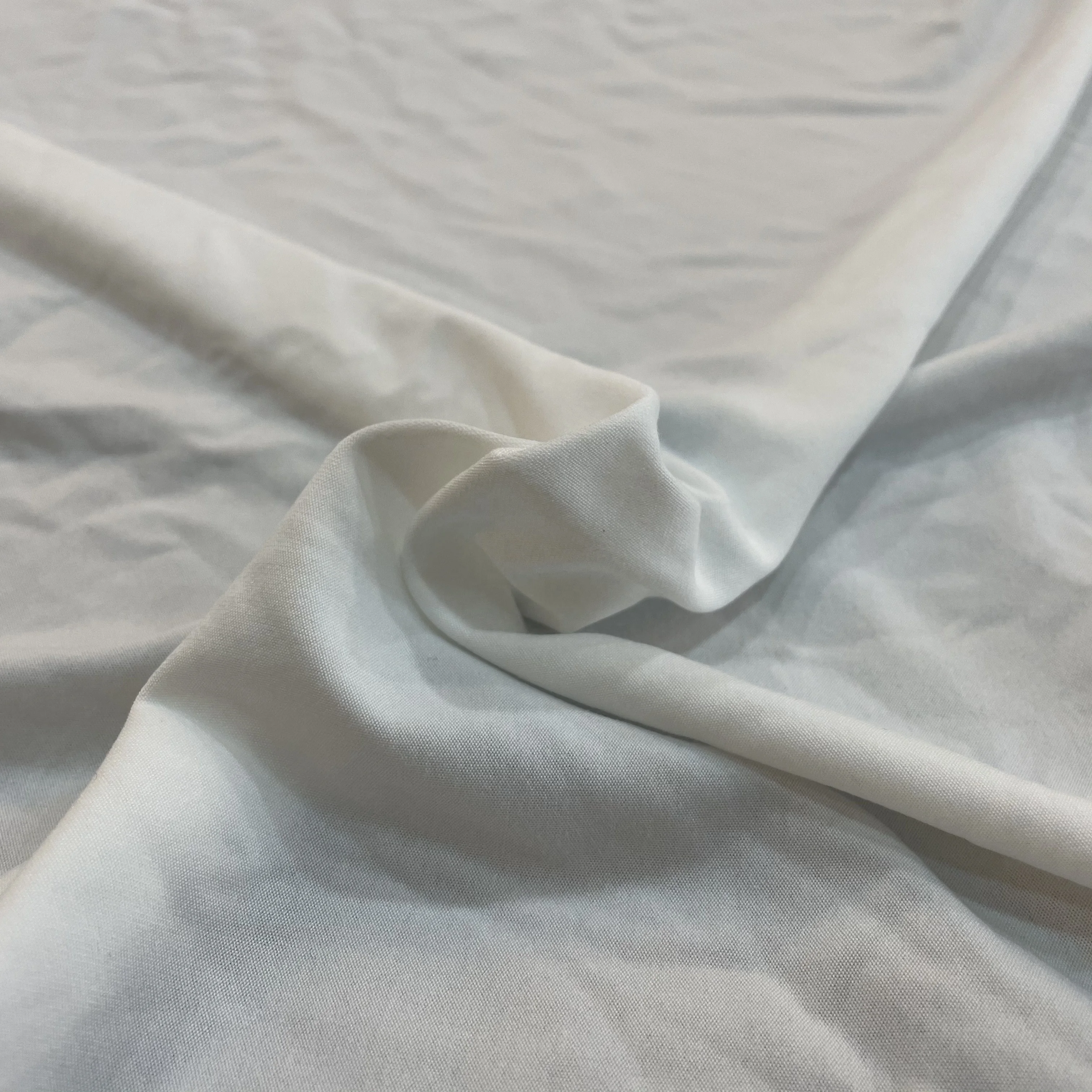 Stocklot Factory Direct Wholesale Cheap Price Knit Polyester Spandex Single Jersey Yummy Elastic Milk Silk Fabric For Leggings