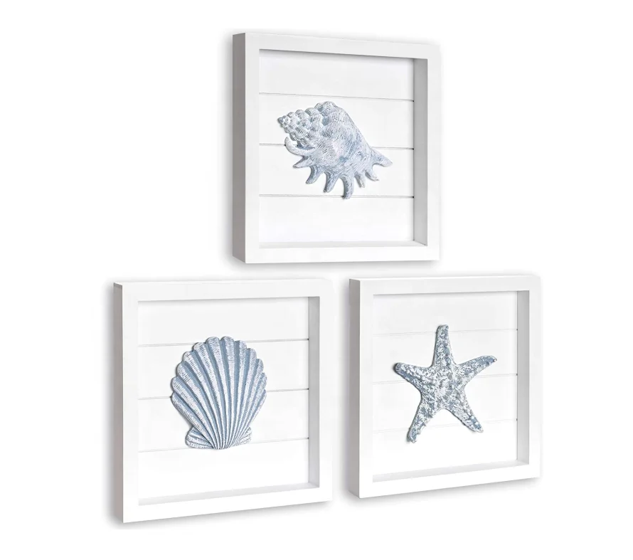 Beach wall decorated with blue shells and starfish, 3 white wooden frames, suitable for bathroom or coastal bedroom, home