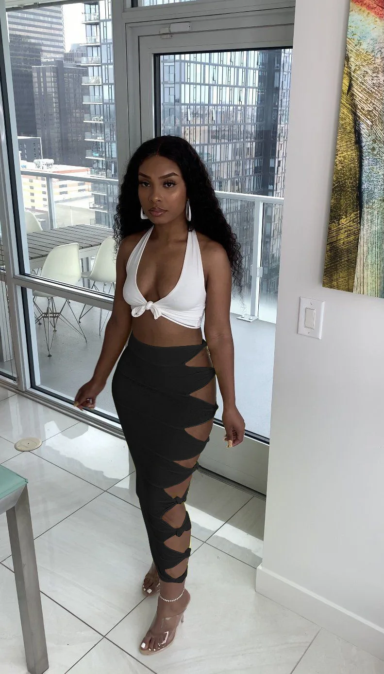 Street sexy solid color knotted and ripped stitching female long skirt