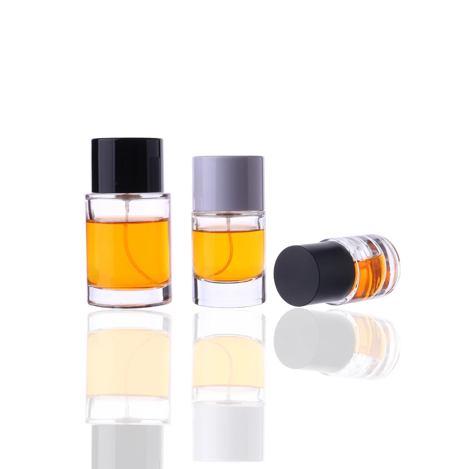 Wholesale high quality thick based cylinder clear 30ml 50ml 100ml glass perfume bottles with customized wide round caps