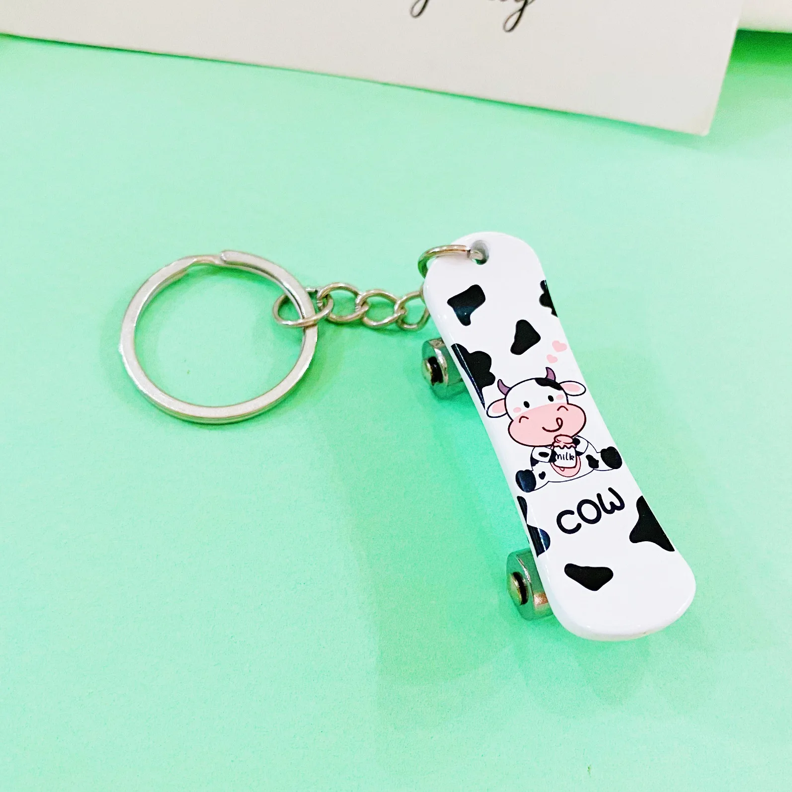 Wholesale creative alloy four-wheel double-warp scooter commemorative keychain sliding necklace pendant keychain