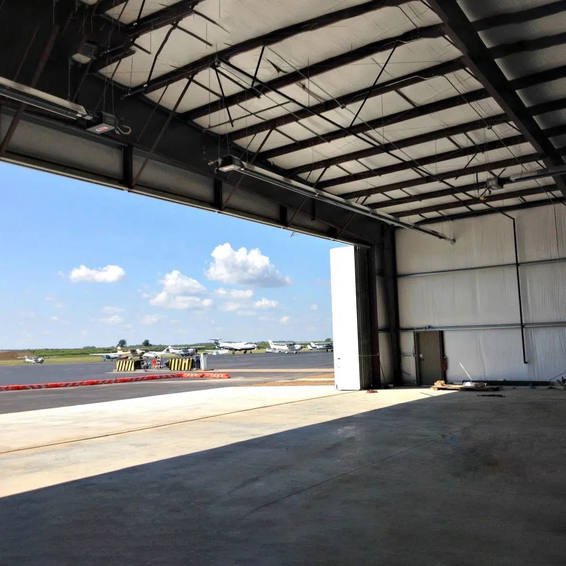 Cheap Prefabricated Steel Structure Frame Australia Hangar Warehouse and Water tank Tower Workshop 4s Showroom