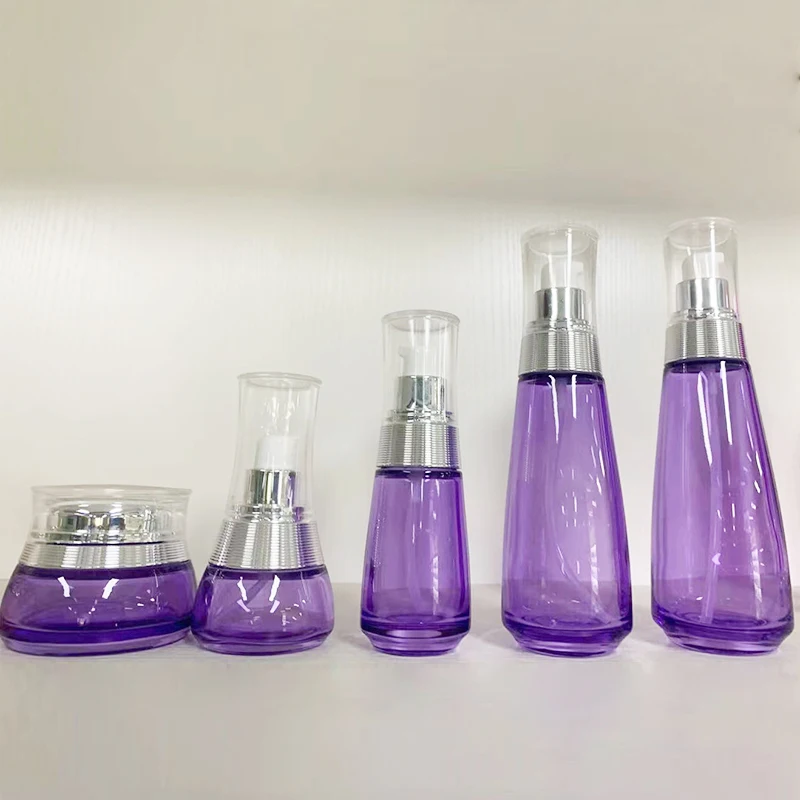 2022 Luxury 50g 30ml 40ml 100ml 120ml purple glass cosmetic lotion pump bottle and cream jar set skin care sets