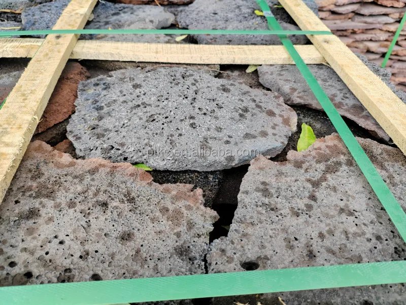 Natural red volcanic lava rock slate stone for pavement roads and wall cladding and floor patios loose lava stone slate