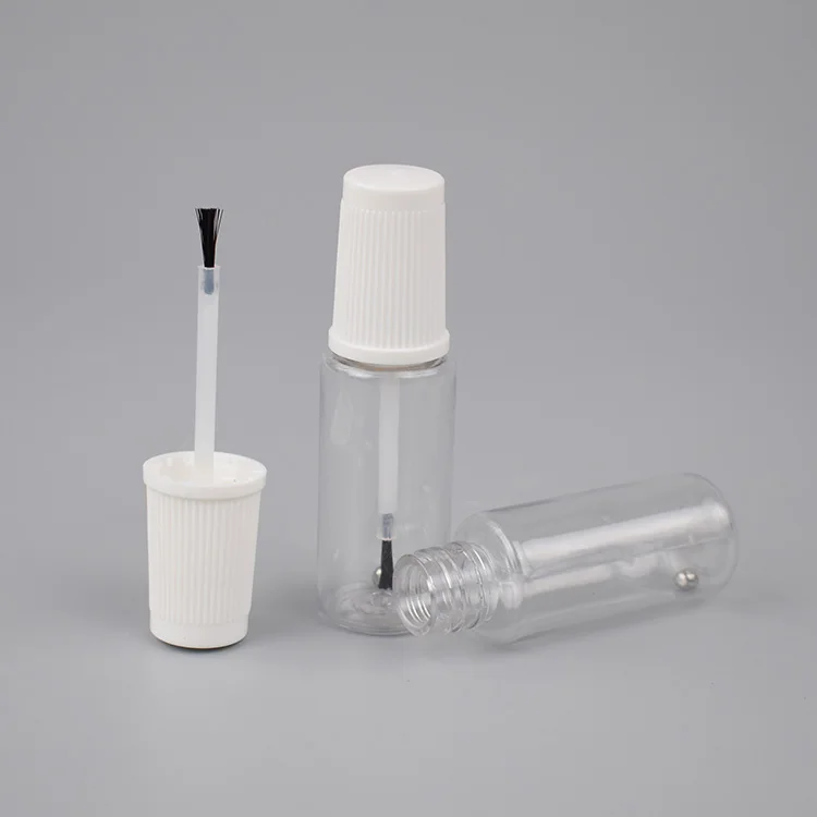 Empty  car repair paint  rpet  bottle with mixing ball and brush