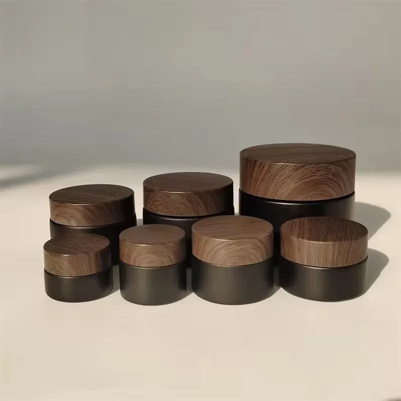 Wholesale 20g 30g 50g 80g 100g Cream Matte Black Glass Jar with New Wood Grain Cover Facial Cream Bottle