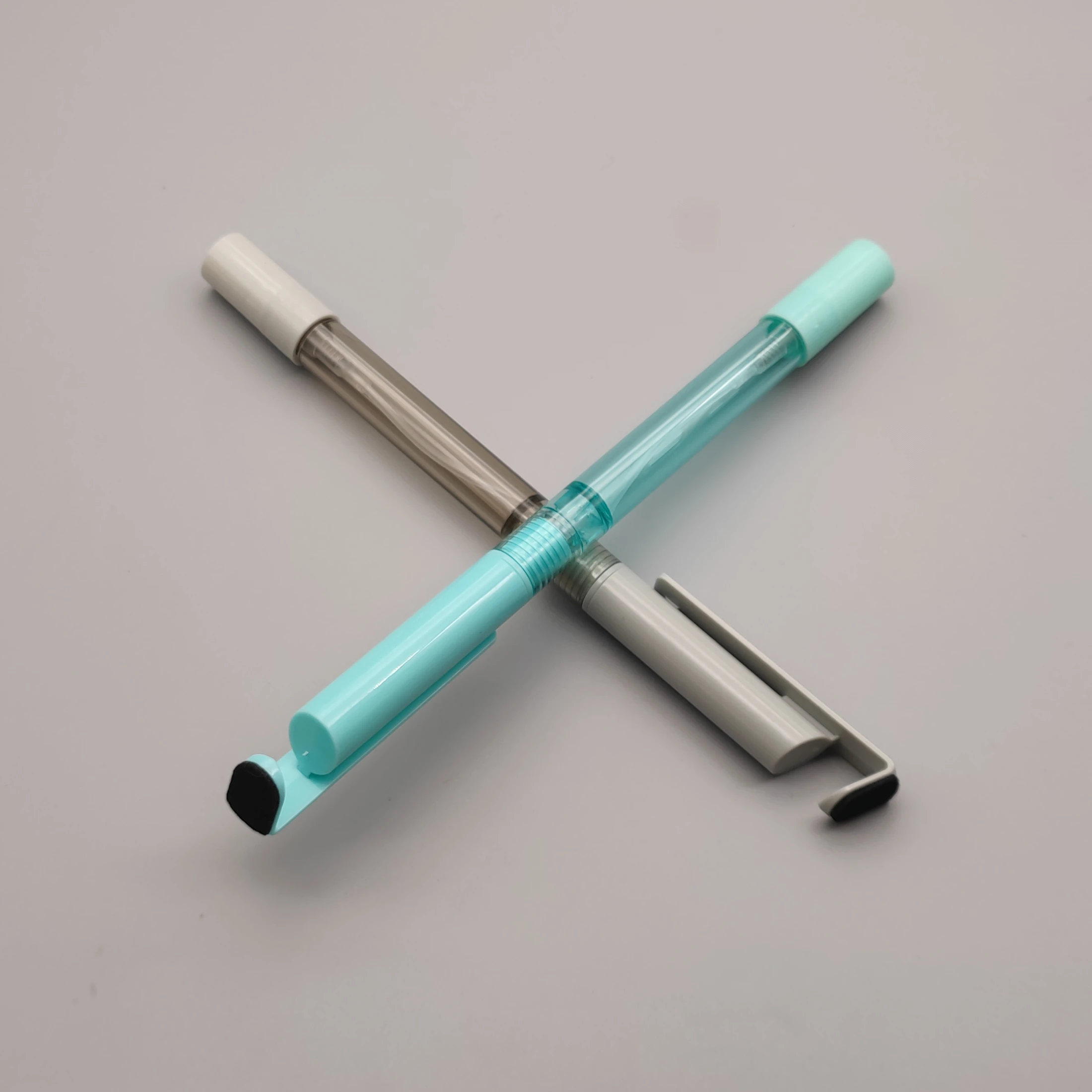 Manufacturer direct sale multi-functional ball point pen cell phone holder and spray pen custom logo printed neutral pen