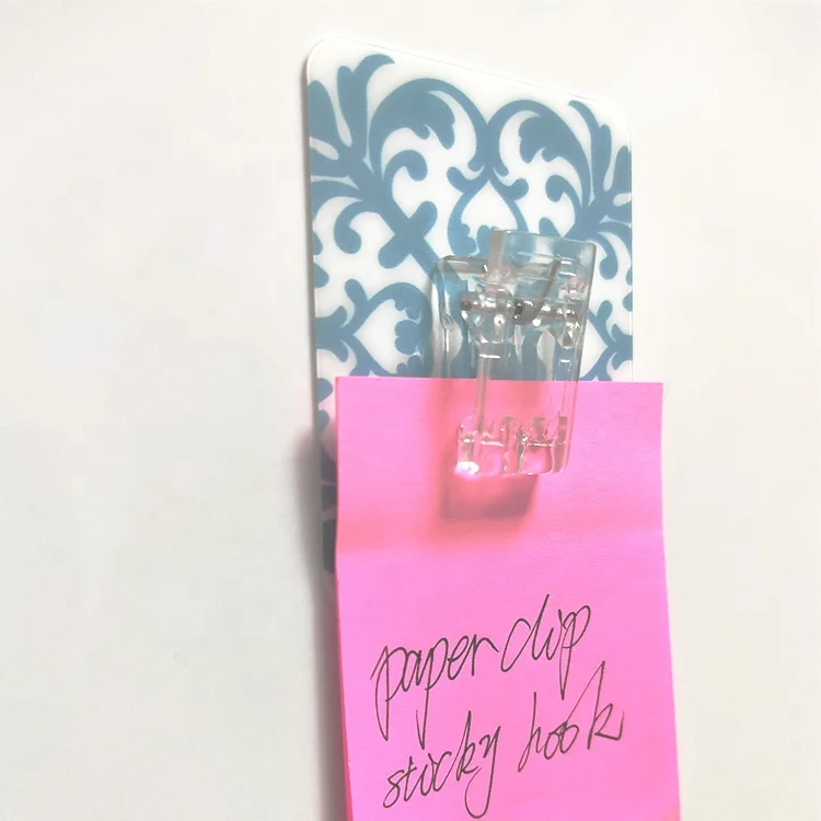 Sticky plastic spring loaded clip paper hook
