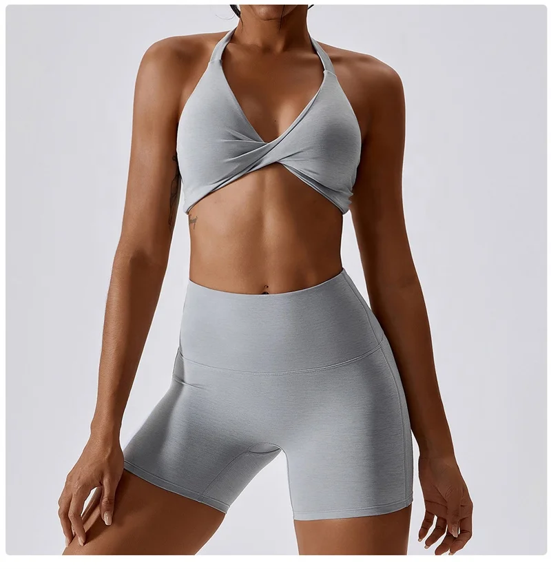 OEM Sportswear Custom Logo New Arrival Women Padded Nude Yoga Hanging Neck Twisted  Bra Fitness Sexy Blank Sports Bra For Women