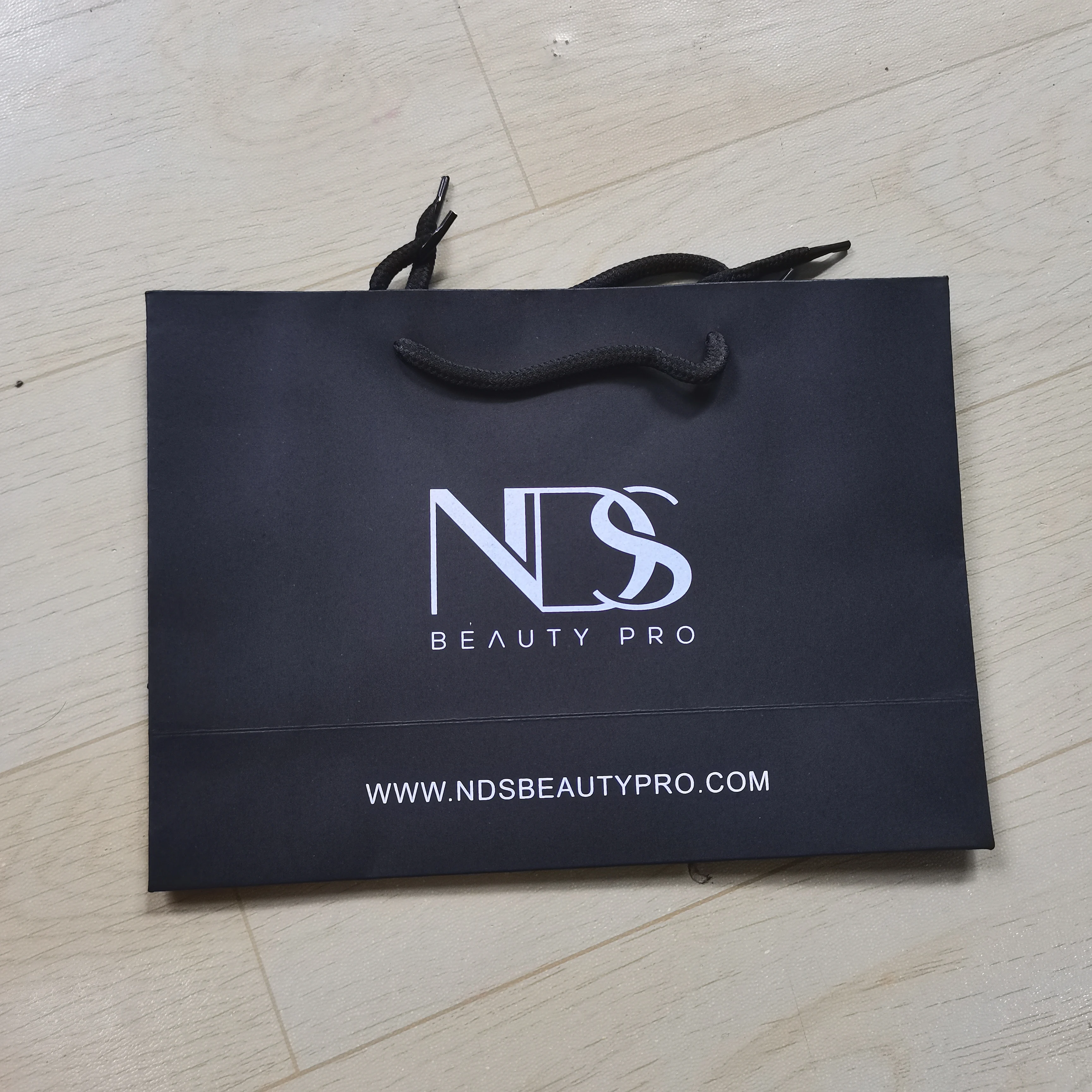 Wholesale custom printed black luxury shopping gift paper bag with handle and bow ,luxury paper bags with your own logo