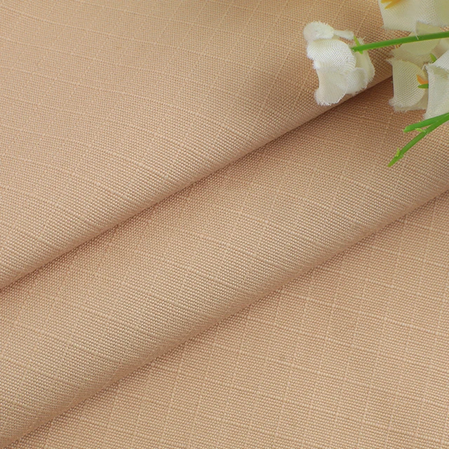 Wholesale plain-dyed woven thick strand beaded canvas lattice 100% cotton fabric for coat pants bags