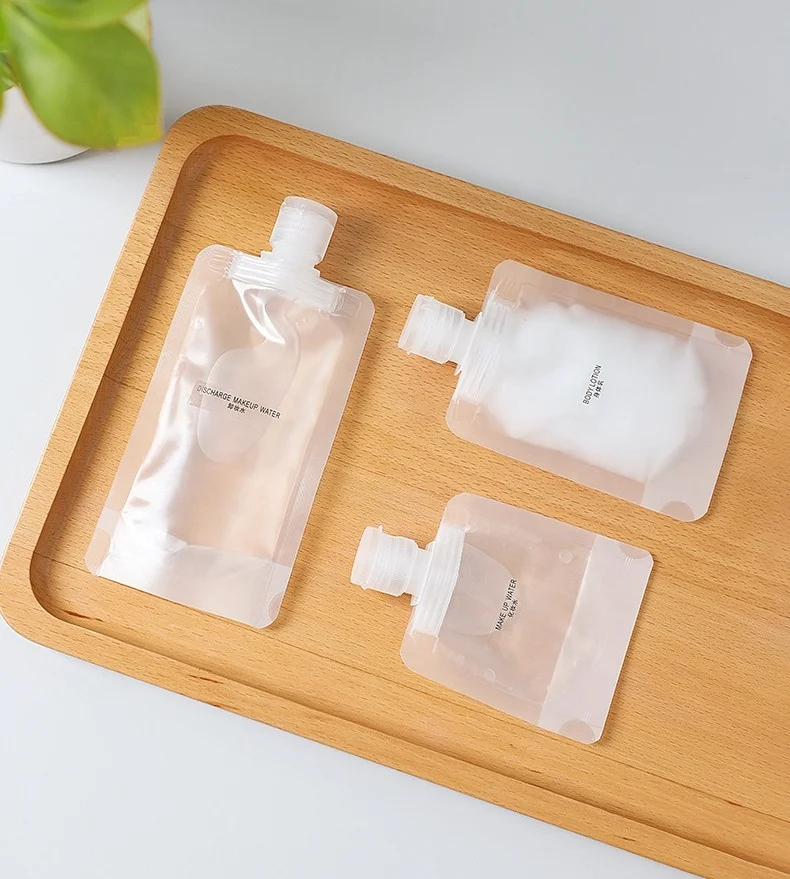 In stock beverage cosmetic packaging 30ML 50ML 100ML reusable stand up transparent spout pouch bag PET plastic bags
