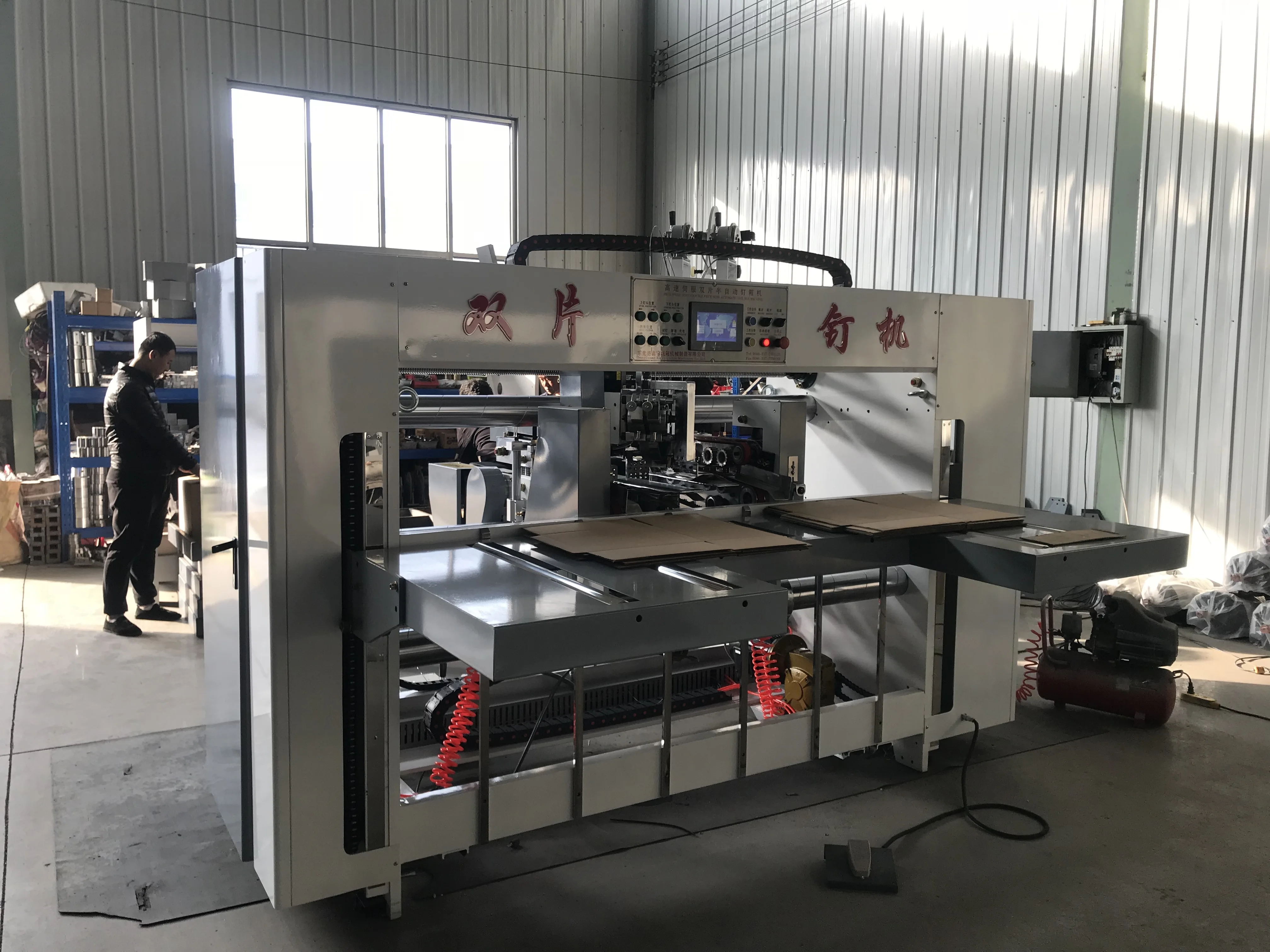 Cardboard box making machine stitcher