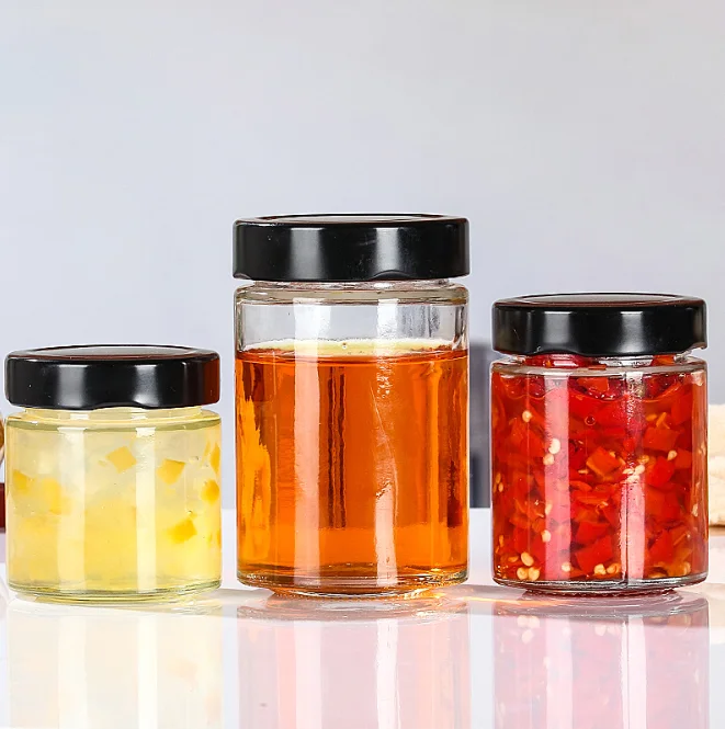 Multiple capacities round  honey bottle glass containers with honey with caps