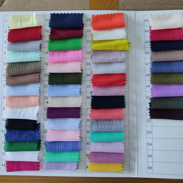 A variety of popular colors 100% polyester fiber crepe chiffon fabrics used in clothing scarves