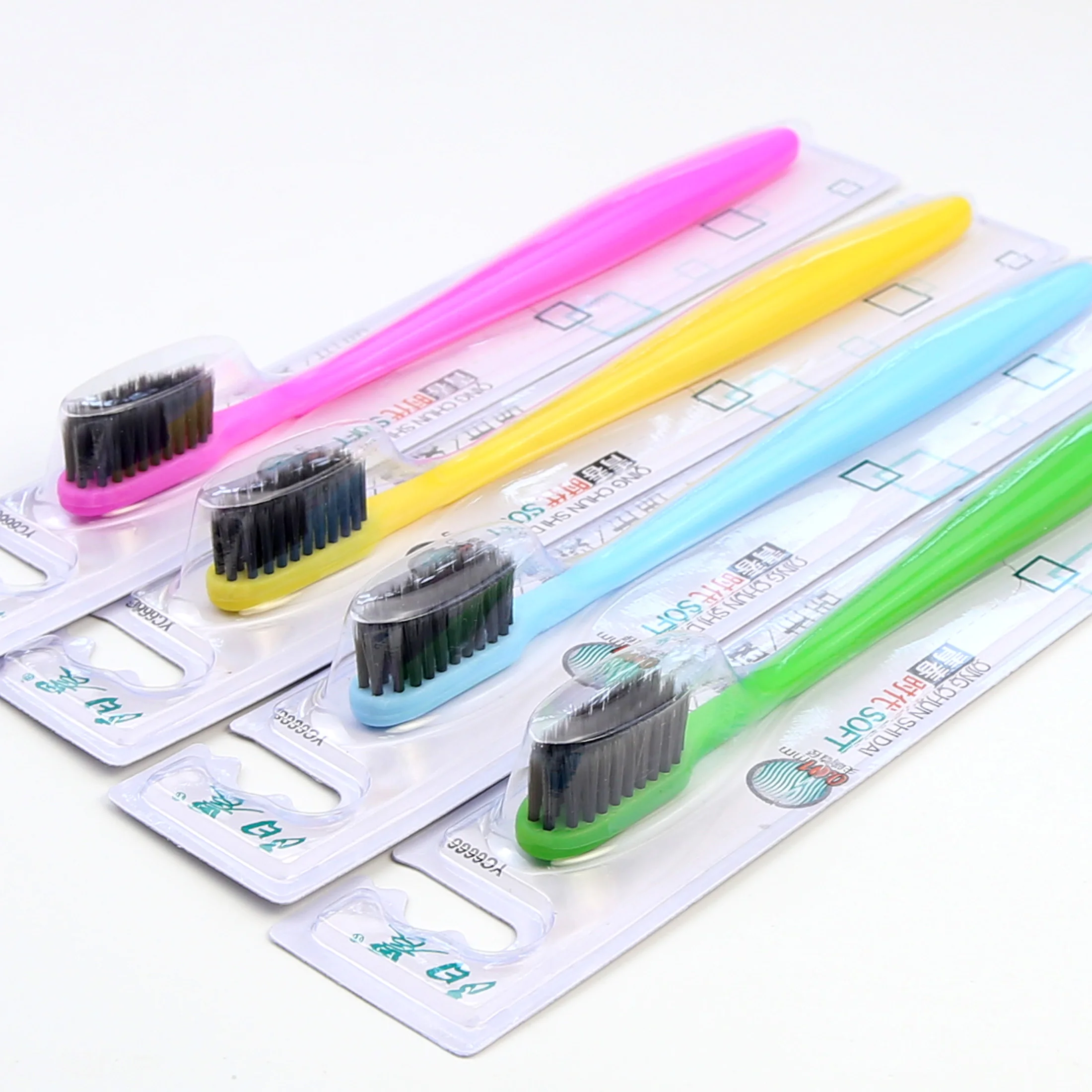 Popular Plastic Yoothbrush with Soft Charcoal Filament Individual Blister Card In one 30pcs Tray Sunny Morning Brand