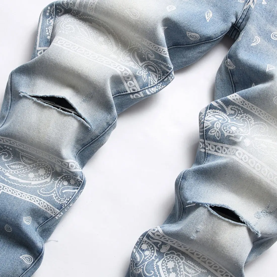 AeeDenim OEM ODM Logo AM light blue elastic slim small straight knee hole cashew flower digital printing denim jeans