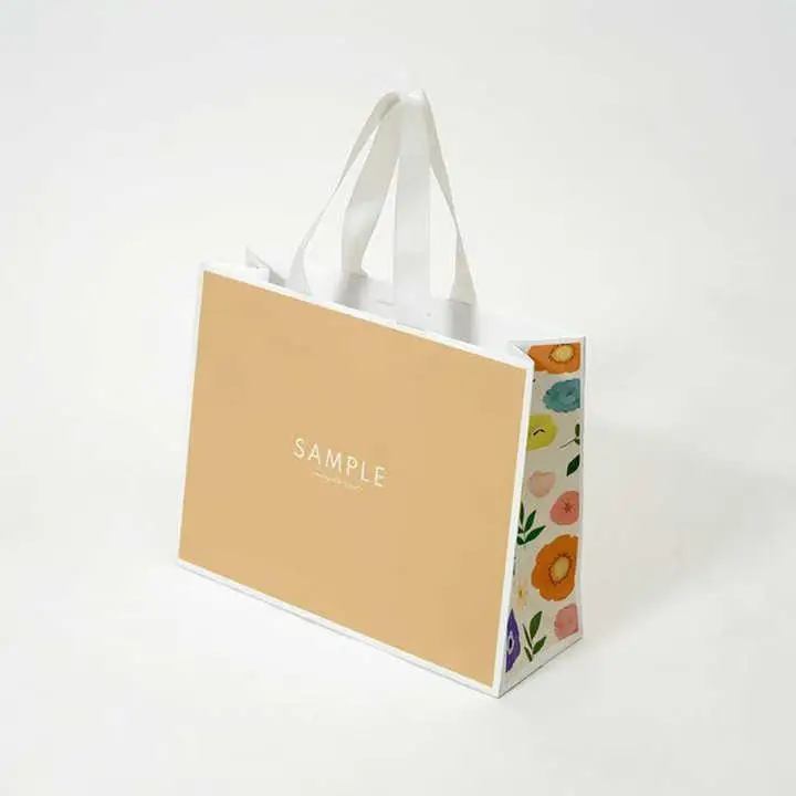 Luxury clothing retail gift paper bag shopping packaging paper bag with handle