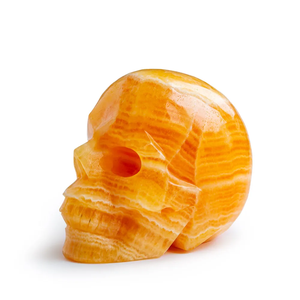 Wholesale Natural Reiki Gemstone Hand Carved Orange Calcite Crystal Skulls Crafts Healing Stone For Home Decoration