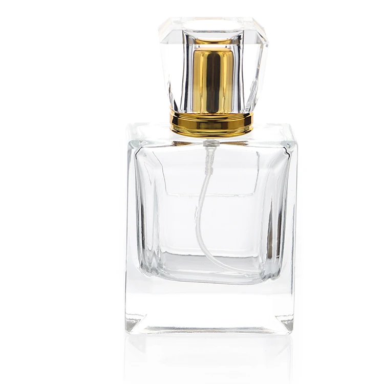 Promotional in stock  50ml empty clear glass perfume bottle with decorative lid square perfume bottle