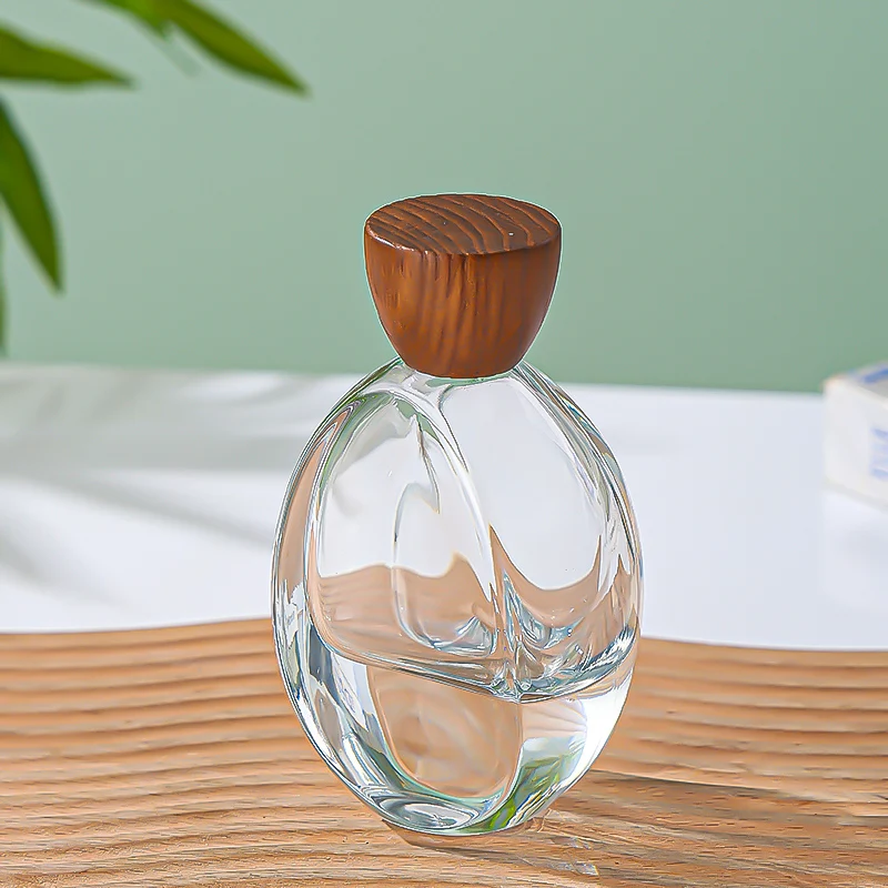 Luxury Custom Transparent Oval Perfume Bottle 50ML Thick Bottom Cologne Water Bottle Wooden Cover Perfume Spray