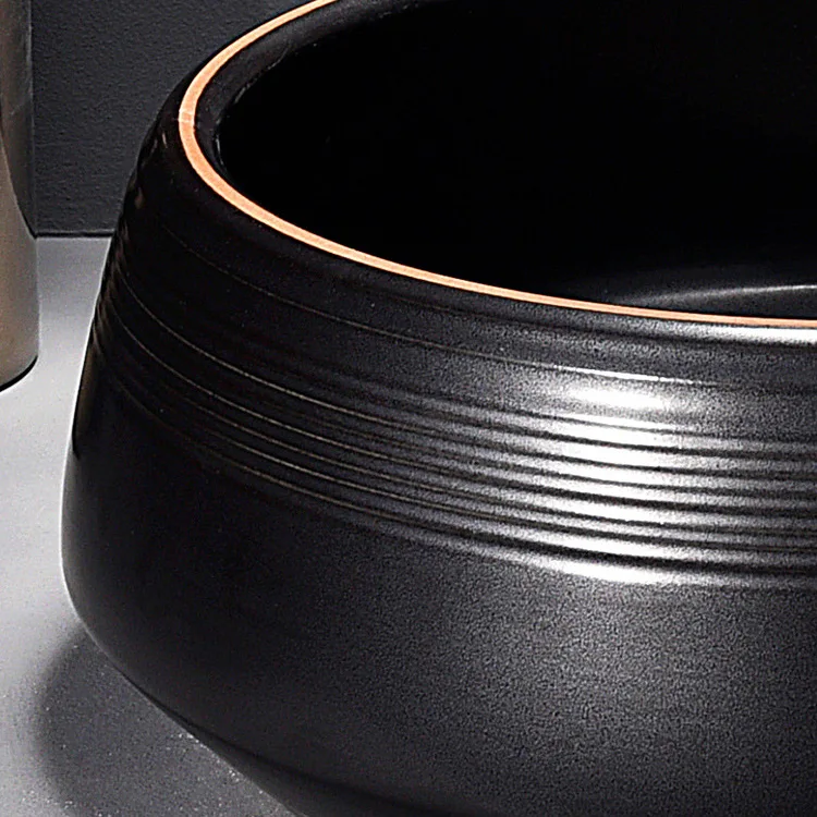 China Artistic Handmade Ceramic Wash Basin Round Counter Top Porcelain Sinks Carved Black Bathroom Sinks