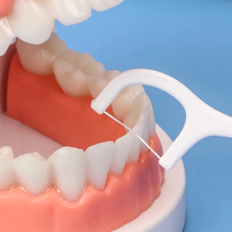 Hot Sale 20PCS Dental floss ultra-fine high tension fine sliding floss stick disposable polymer floss toothpick portable boxODM