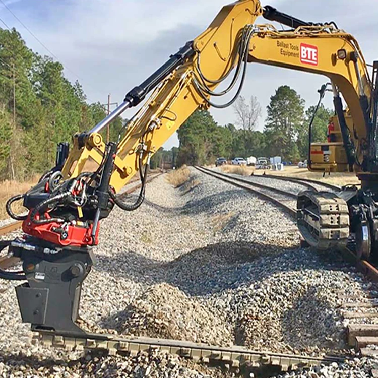 railway excavator with ballast undercutter removes fouled ballast from underneath the railway track