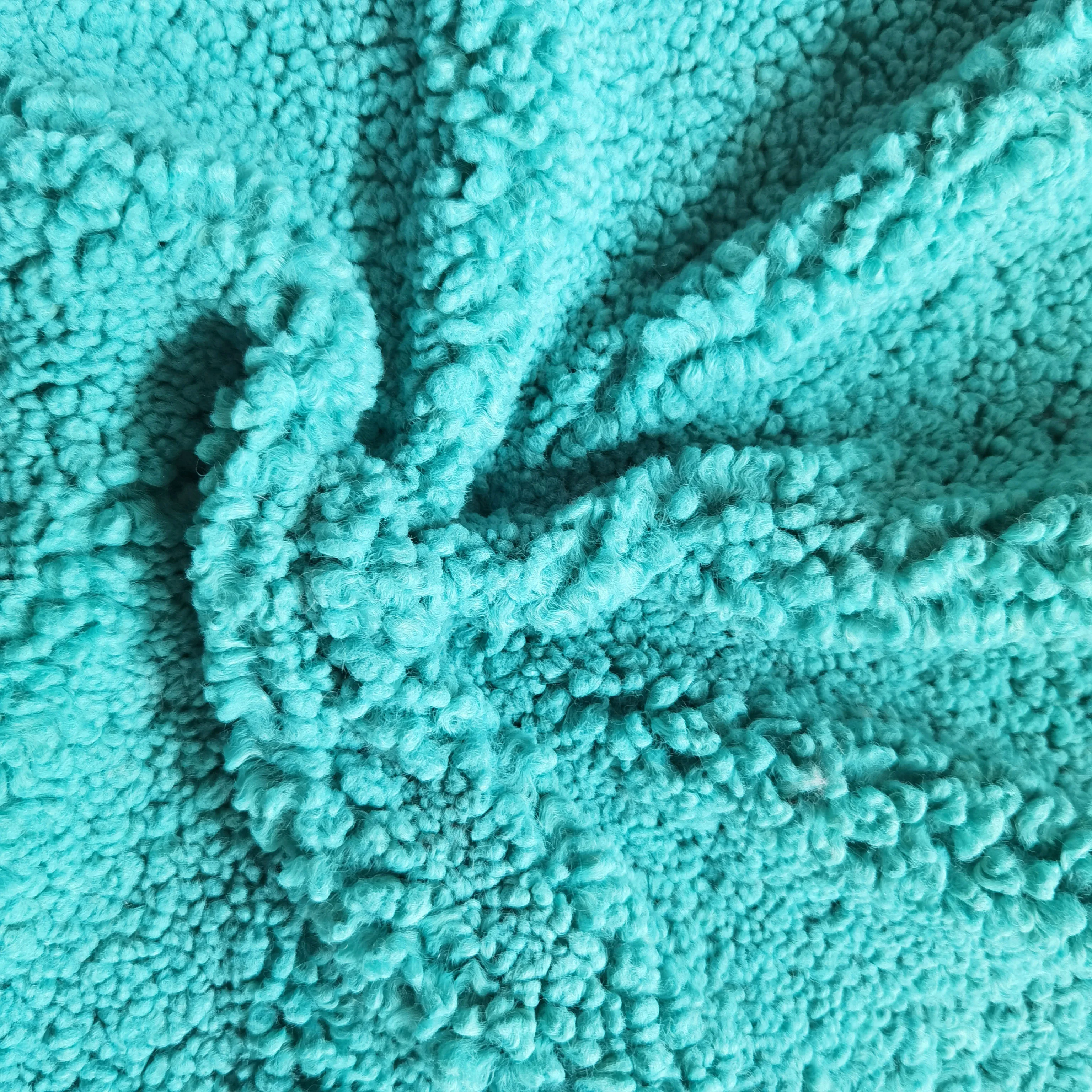 Bright blue dyed soft garment wool roll grain lamb teddy velvet fabric