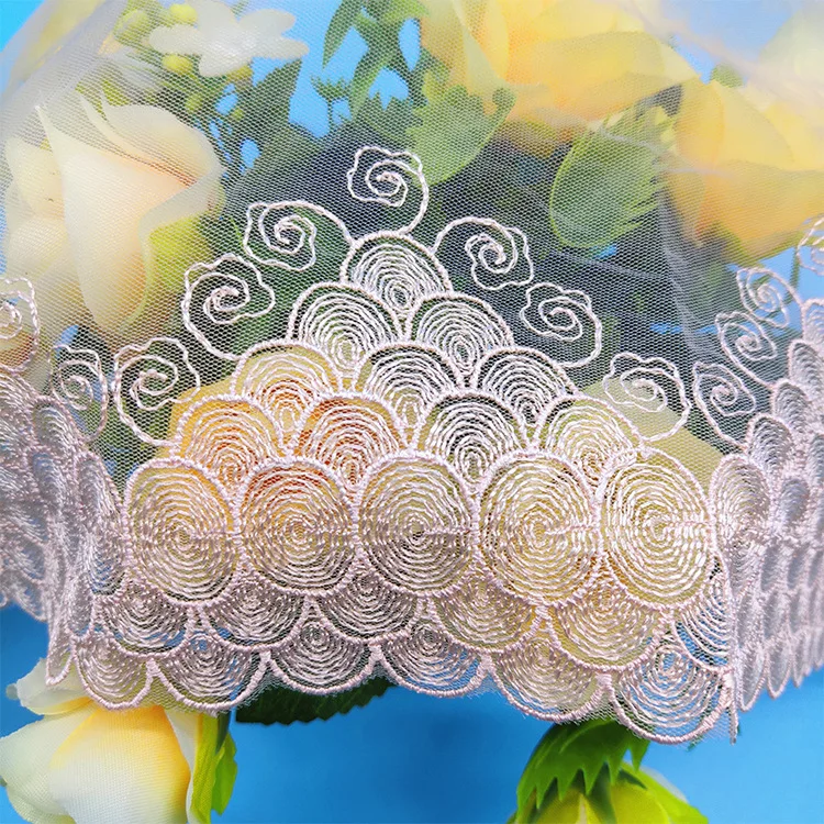 Colorful embroidery lace trimmings handmade dress placed wedding fabric