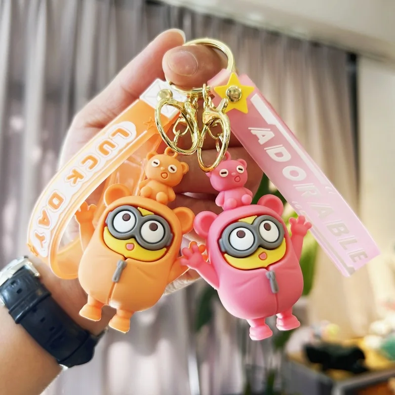 New creative cartoon cross dressing hoodie small yellow keychain PVC rubber pendant doll student backpack pendant accessories