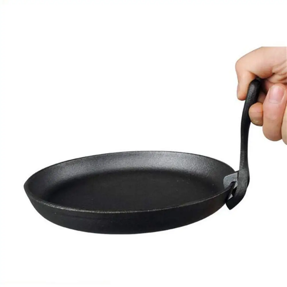 Cast iron frying pan with wooden board
