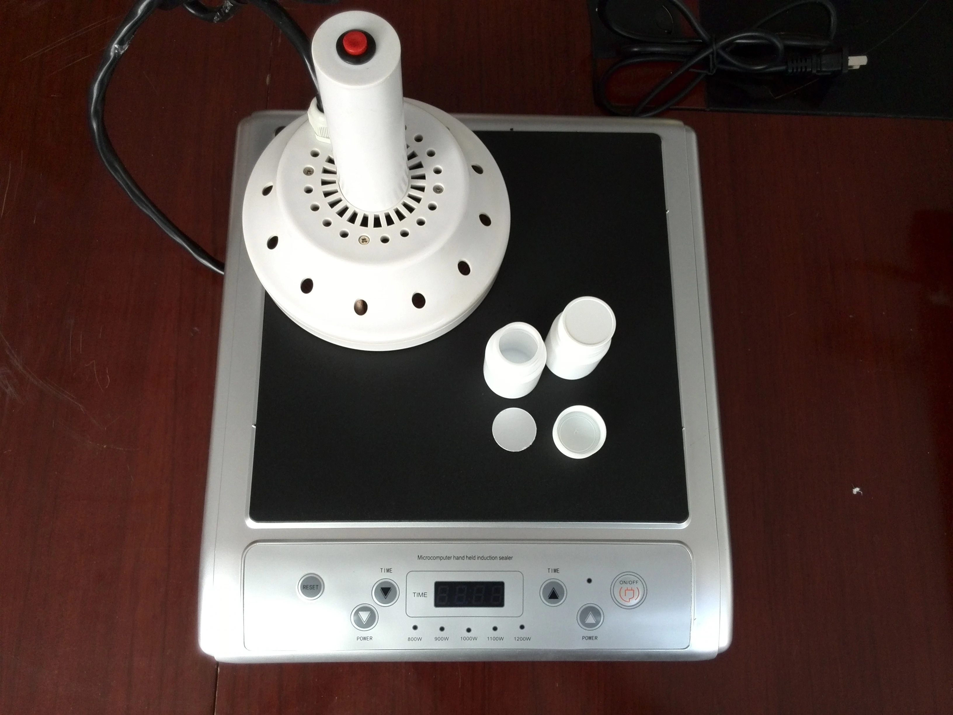 Manual induction aluminum foil plastic cover sealing machine