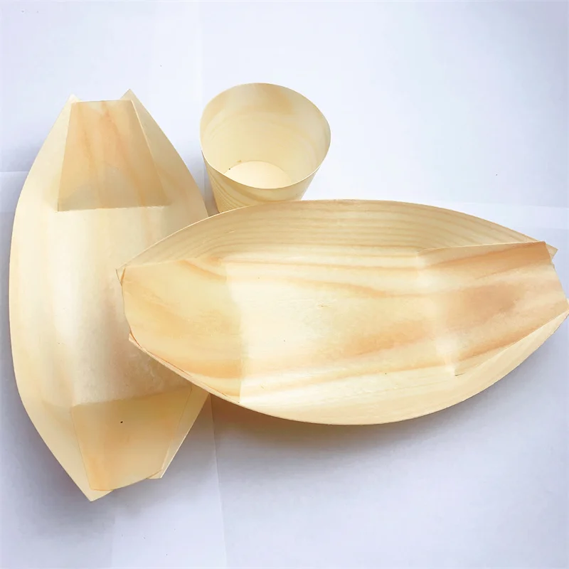 Eco-friendly wooden boat plates, biodegradable, suitable for holding various delicacies and displaying at parties.